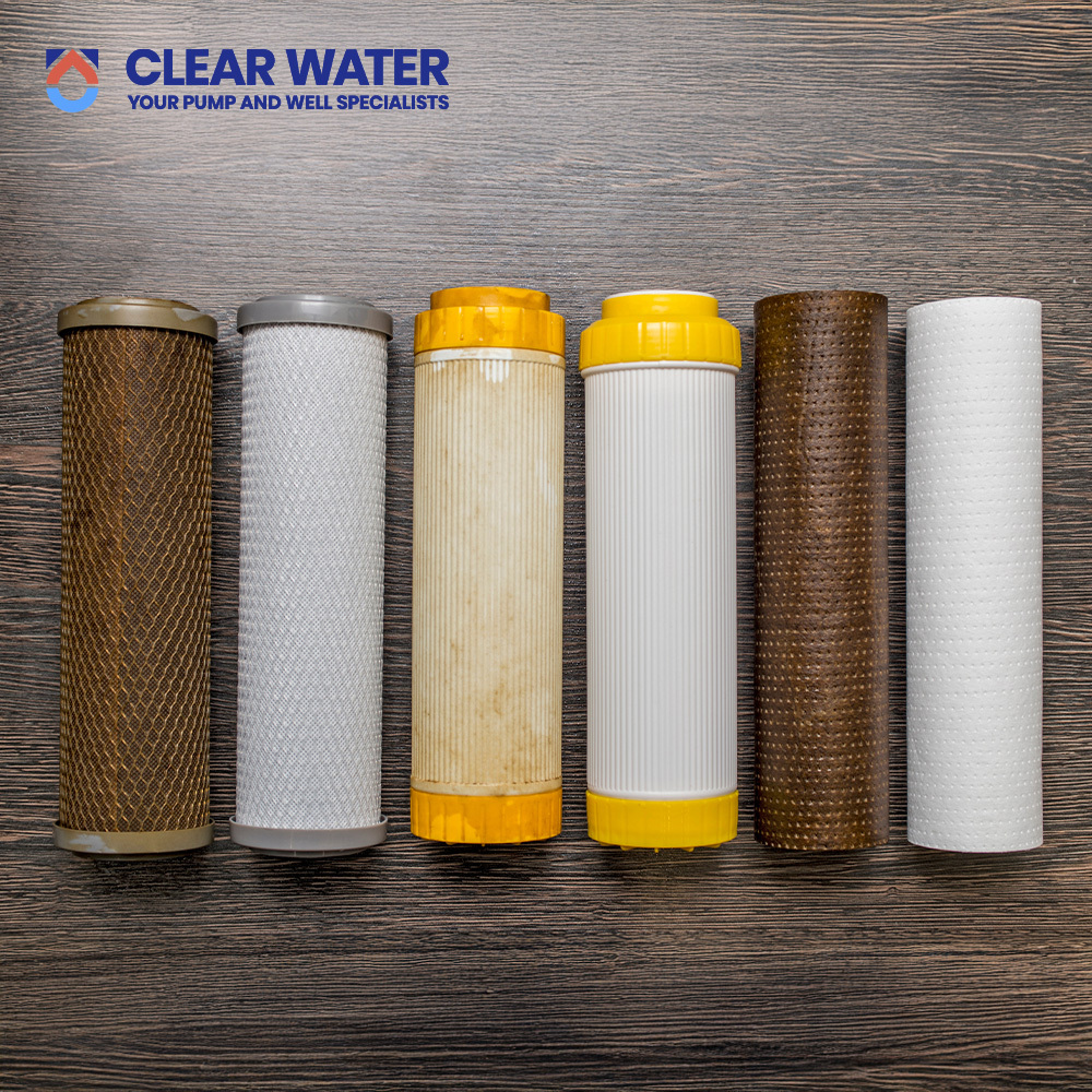 Close-up of a carbon filter being replaced in a residential filtration system